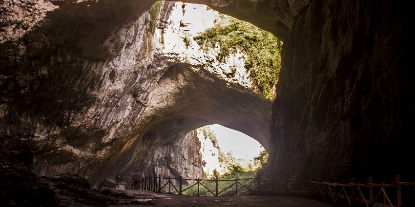 A huge, open-roofed cave known for its archaeological finds and rare bat population.