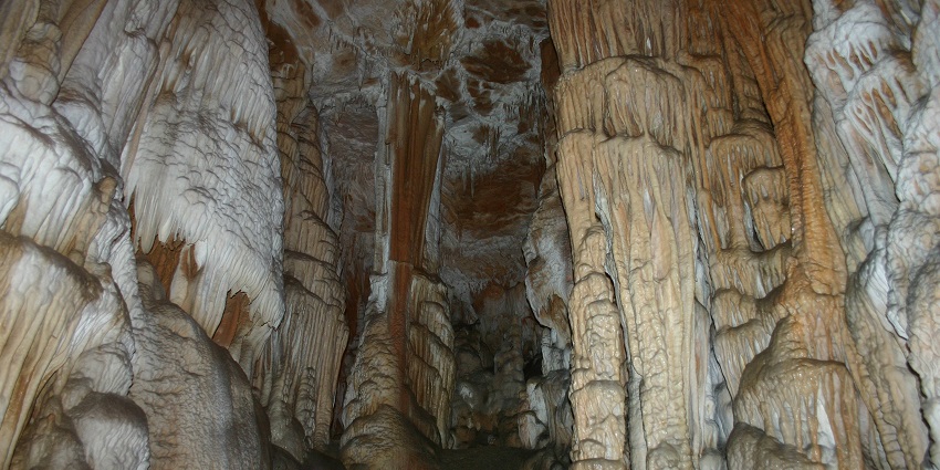 An image of Jama Dimnice cave in Slovenia, showcasing the natural rock formations.