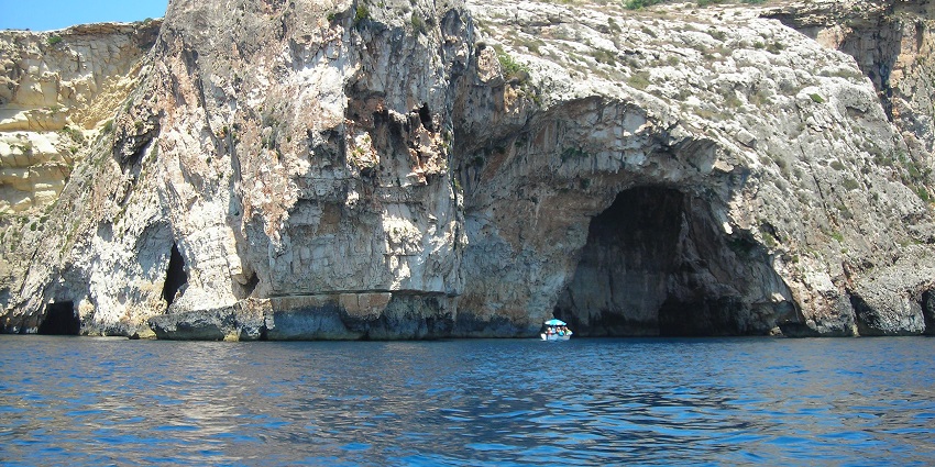 A sea cave with glowing blue waters, accessible by boat, is among the things to do in Capri.