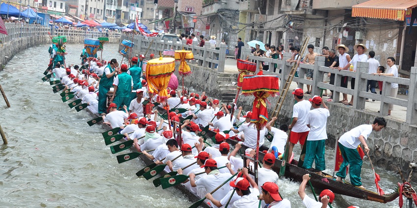 Rowers participate in races of decorated dragon boats during the Dragon Boat Festival.