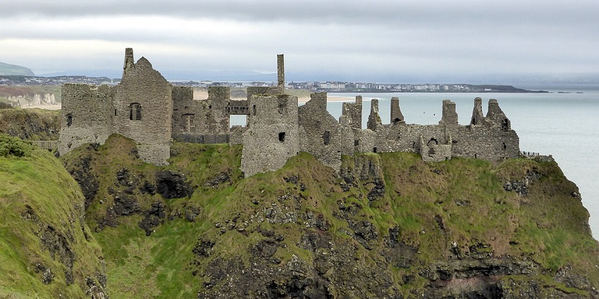 A view of Dunluce Castle's dramatic ruins- one of the top places to visit near Belfast.