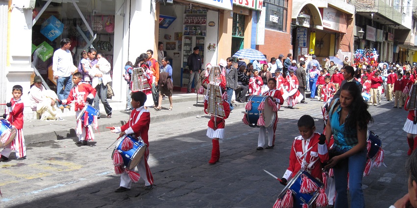 Ecuador Independence Day parade celebration with colorful costumes, music and dancers during Festivals in Ecuador.