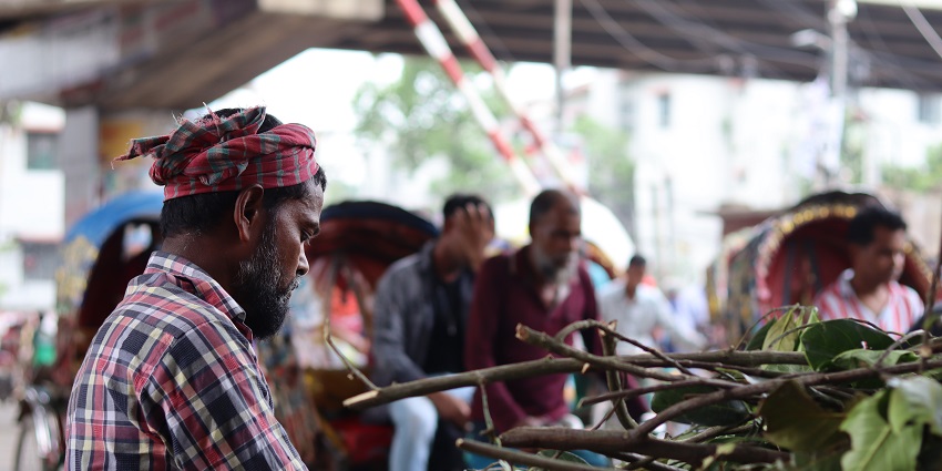 Festivals in Bangladesh include Eid al-Adha, a cattle market crowded with buyers.