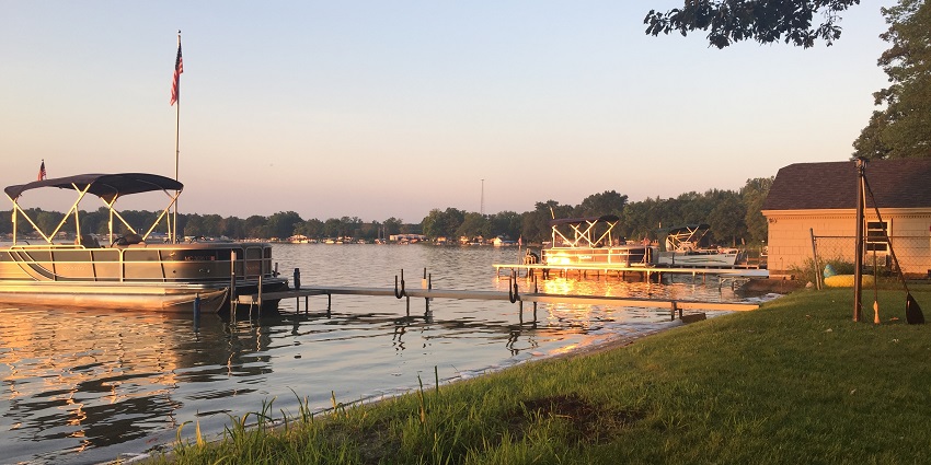 An image of Gun Lake at sunrise, one of the best things to do in Barry County Michigan.