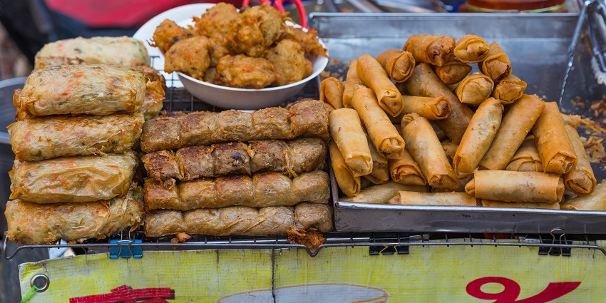 Image of a mouth-watering delicious street food at a street vendor stall in the food market