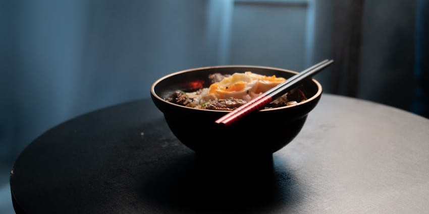 Image of a dish similar to the Escovitch Fish,with pickled vegetables and scotch bonnet peppers.