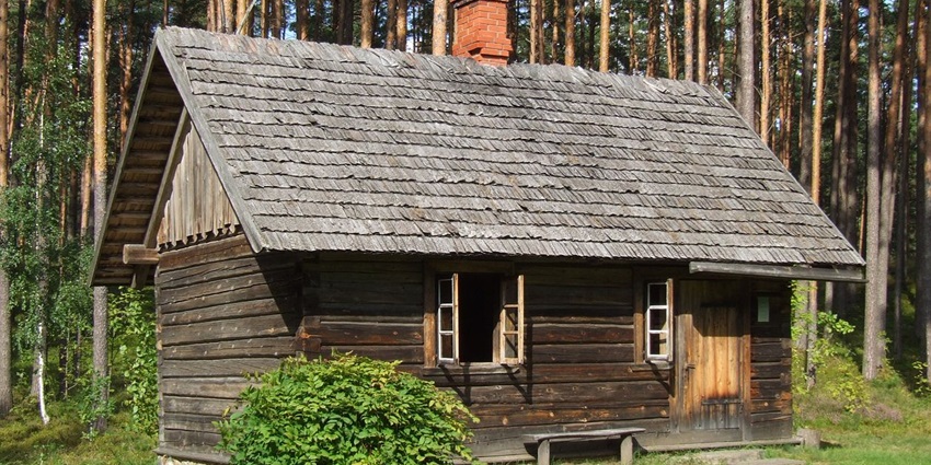 Step back in time exploring traditional Latvian homes, windmills, and crafts in a forested lakeside setting.