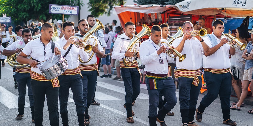 Dance through a whirlwind of music, food, and culture at the world-famous Guca Trumpet Festival.