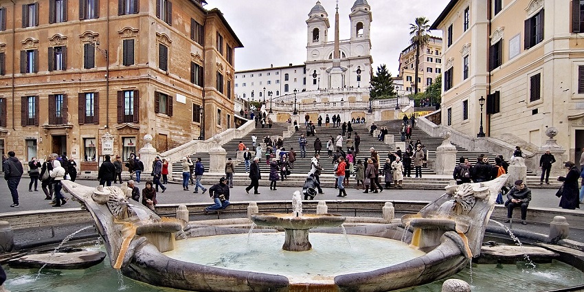 The Spanish Steps in Rome, viewed from Piazza di Spagna, featuring the Barcaccia Fountain