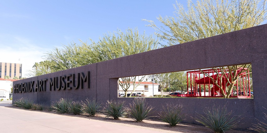 Clean gallery space with visitors observing colourful modern art pieces at Phoenix Art Museum.