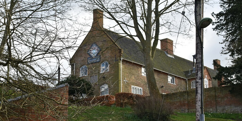 Image of a man exploring the Beccles & District Museum, a famous thing to do in Beccles.