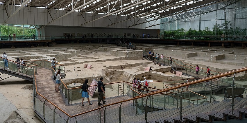 Visitors exploring the archaeological ruins, a historical and fun thing to do in Sichuan.