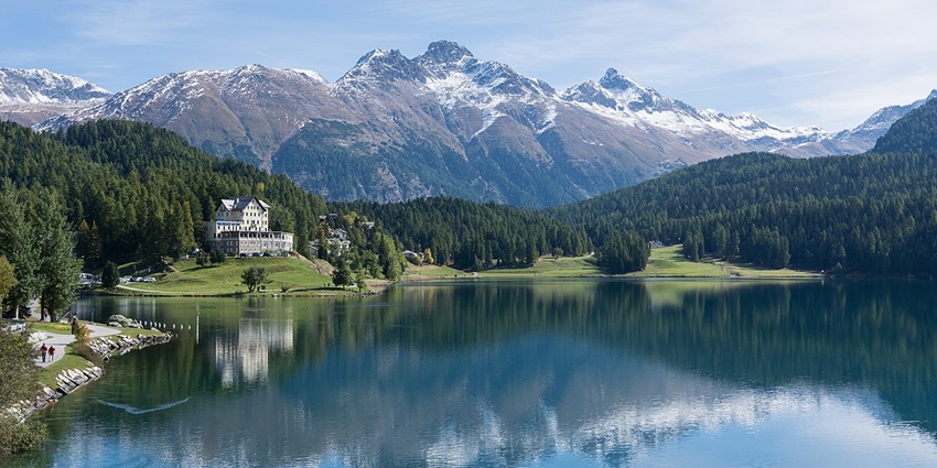 Things to do in St. Moritz include exploring the scenic lake surrounded by snow-capped mountains, perfect for walks or winter events.