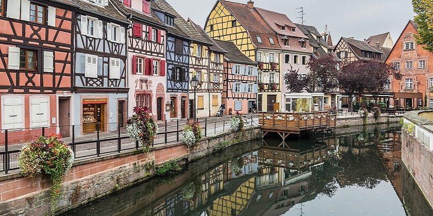 Picturesque Little Venice district in Colmar, featuring traditional houses along the canal