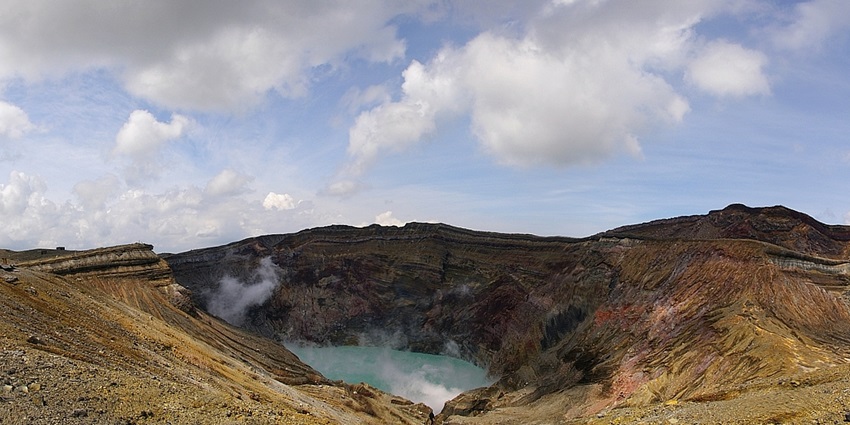 Smoke rising from Mount Aso’s active crater; exploring it is one of the best things to do in Aso.