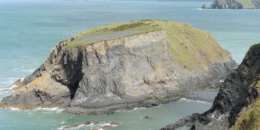 Things to do in Wales include exploring dramatic cliffs, secluded coves, and quaint villages on this scenic coastal trail.