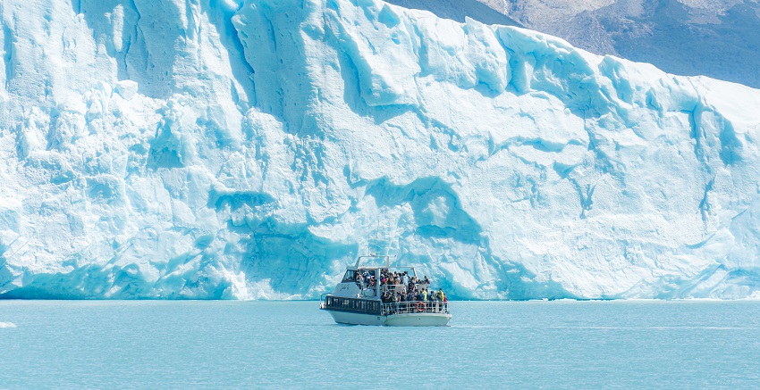 A view of tourists exploring the Perito Moreno, a fun thing to do in Patagonia, Argentina.