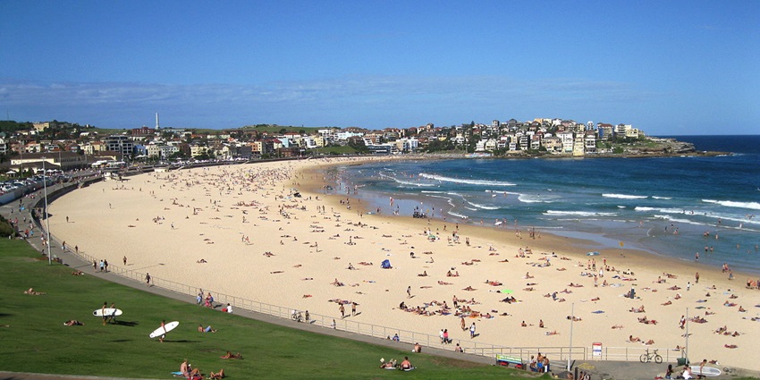 People walking along the Bondi to Coogee track with ocean views in Australia in March.