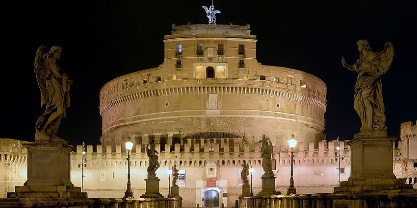 Castel Sant'Angelo illuminated at night, reflecting Rome's timeless elegance and beauty