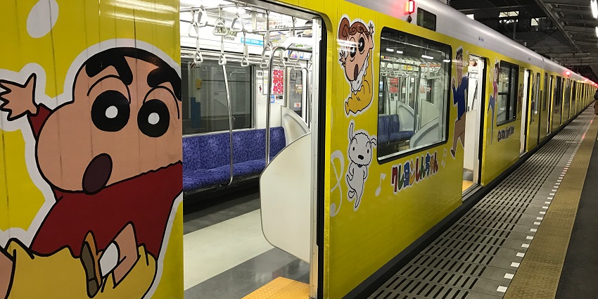 Original Crayon Shin-chan artwork displayed on a wall is one of the best things to do in Kasukabe.