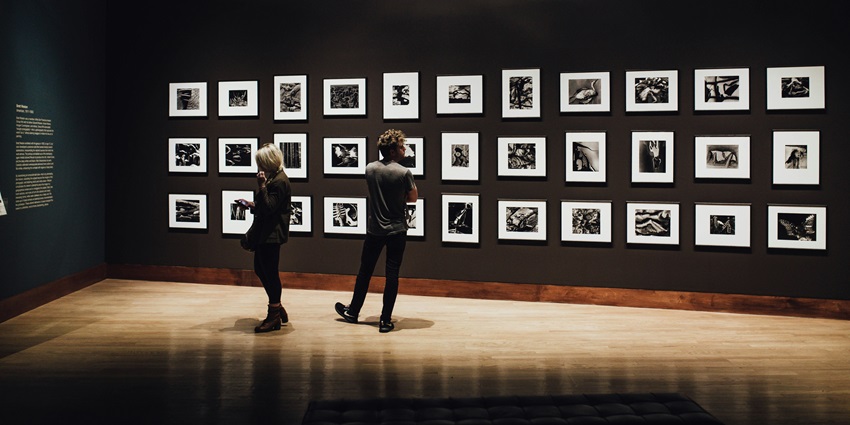 Image of photos hanging on the walls inside the halls of the Photographic Museum Of Mauritius.