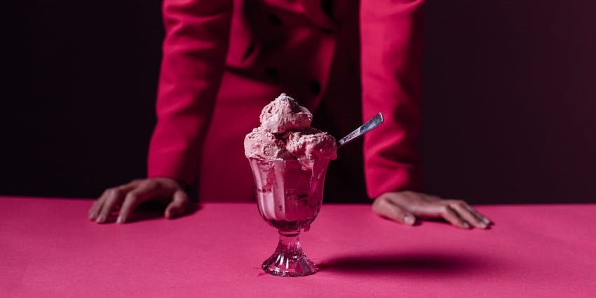 People ready to taste the gelato at an ice cream museum, among cool things to do in SoHo.