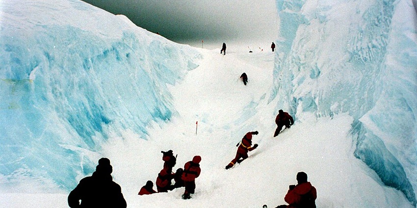 An image of the tourists exploring the massive Ross Ice Shelf, the best thing to do in Antarctica.
