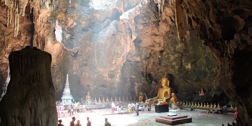 Exploring the sacred cave temple with golden Buddha statues is one of the top things.