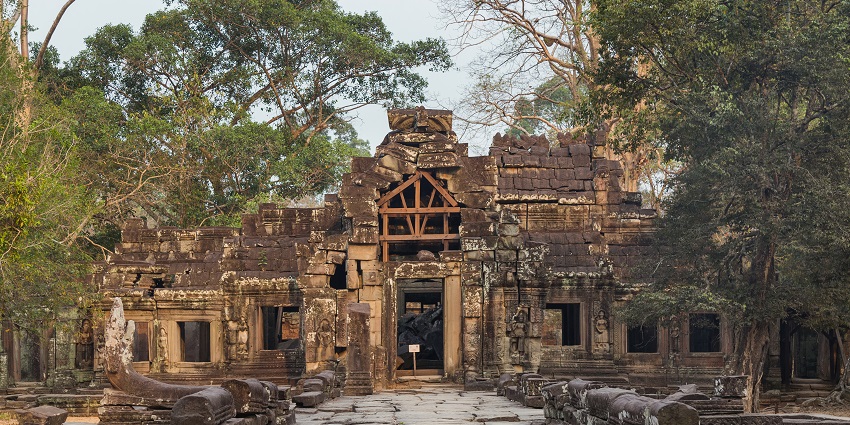 Long corridors and sandstone chambers inside the peaceful Banteay Kdei temple