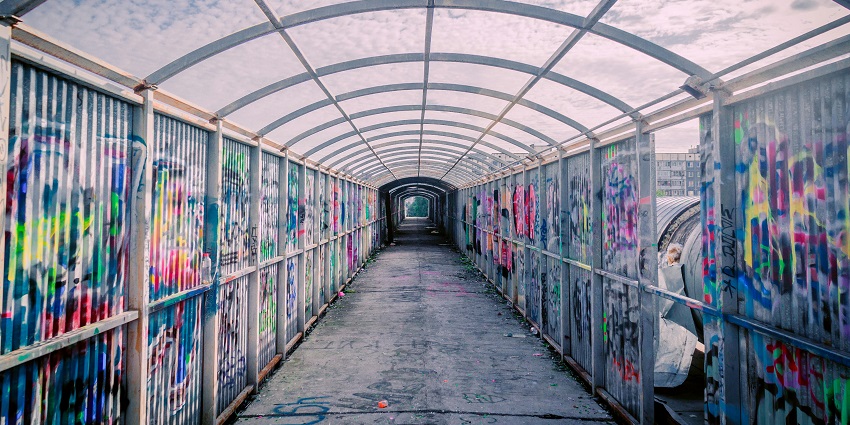 An image of the Peace Walls in Belfast, covered with murals and messages of peace.
