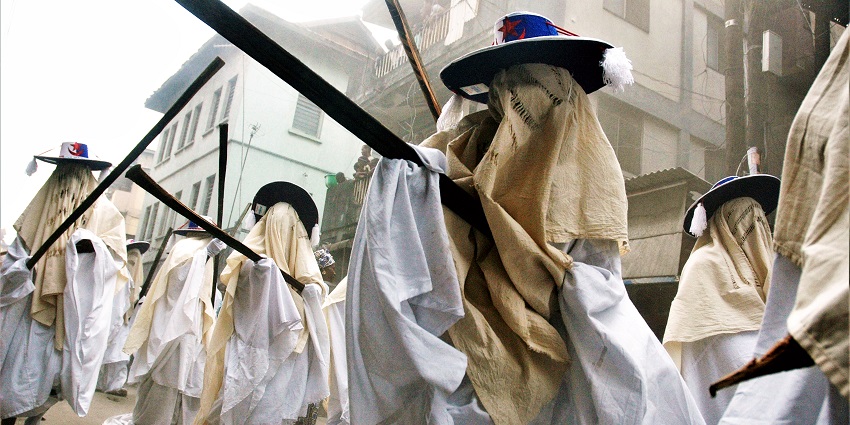 A vibrant Lagos celebration featuring white-clad masqueraders parading through the streets, among the famous festivals in Nigeria.