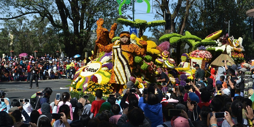 A vibrant celebration of flowers at the Feria de Las Flores in Colombia, showcasing colorful parades and floral displays.