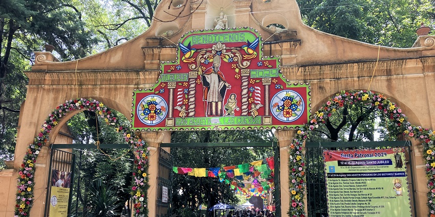 A floral decoration on the facade of the entrance of a temple in Mexico during a fair