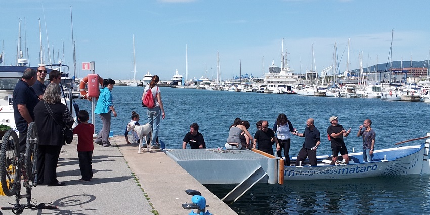 People boarding a speedboat during the Festival del Mar de Mataró in Spain.