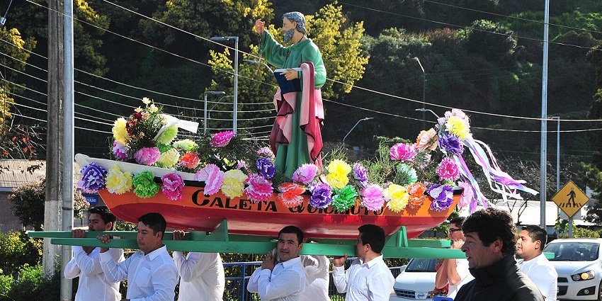 An image of fishermen parade decorated boats to honor their patron saint, San Pedro.