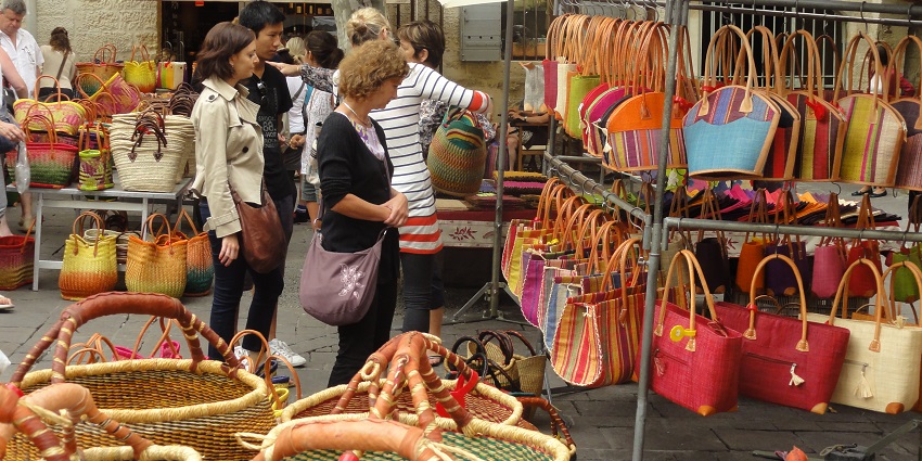 Handwoven straw basket commonly used in French markets, perfect for picnics or shopping.