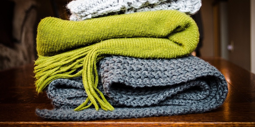 Elegant French scarves displayed in a boutique, showcasing classic Parisian style.