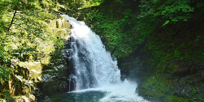 Scenic view of Fudo Falls in Fukushima with turquoise blue water and lush greenery