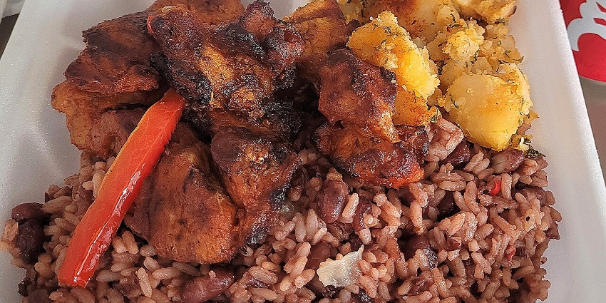 An image showing gallo pinto served with sides, a dish known as a famous food in Costa Rica.