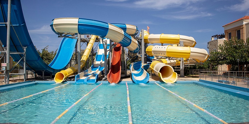 People having fun on exciting water rides at an amusement or water park