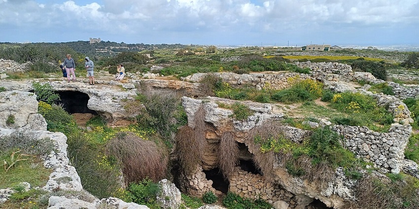 An image of historic cave dwellings inside Għar il-Kbir near Dingli Cliffs, Malta.