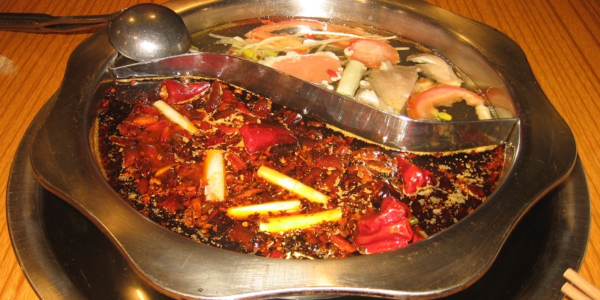 Savour the spicy, flavourful hotpot, a famous local dish enjoyed with various meats and vegetables.
