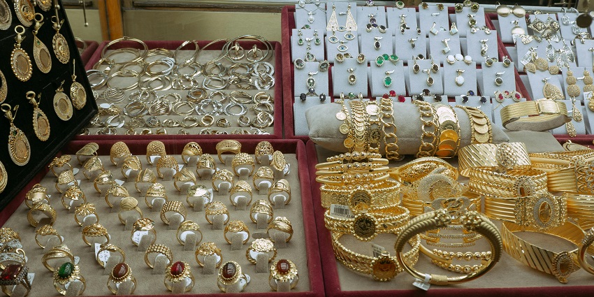 Close-up of elegant gold and silver jewellery, arranged artistically for a luxurious look.
