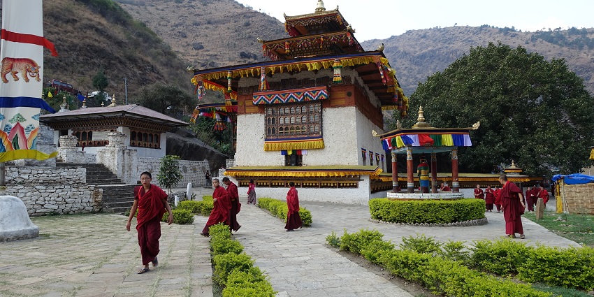 A peaceful monastery carved into a cliff, offering spiritual solitude and vibrant religious festivals.