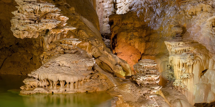 Marvel at the underground river and rock formations at Gouffre de Padirac Caves in France