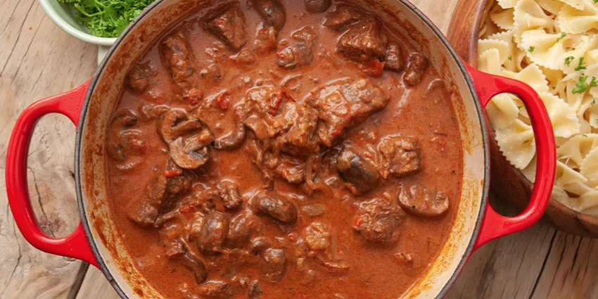 A bowl of Hungarian Goulash with beef and vegetables, representing the best food in Hungary.