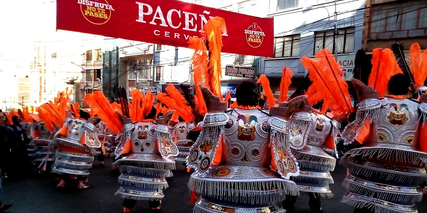Dancers in sequined outfits fill the streets of La Paz during Gran Poder celebrations.