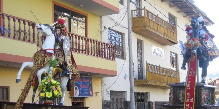 People in traditional attire marching in Santiago del Mayor procession during Guayaquil Festival celebrations.