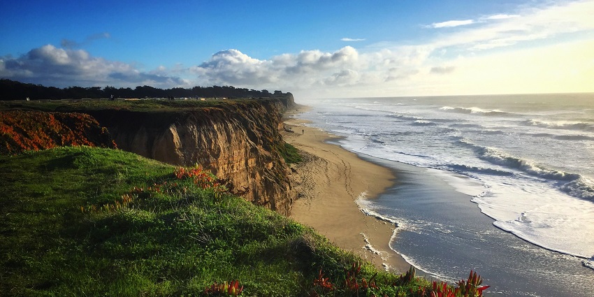 A quiet seaside town with windswept beaches, tide pools, and nearby pumpkin farms.
