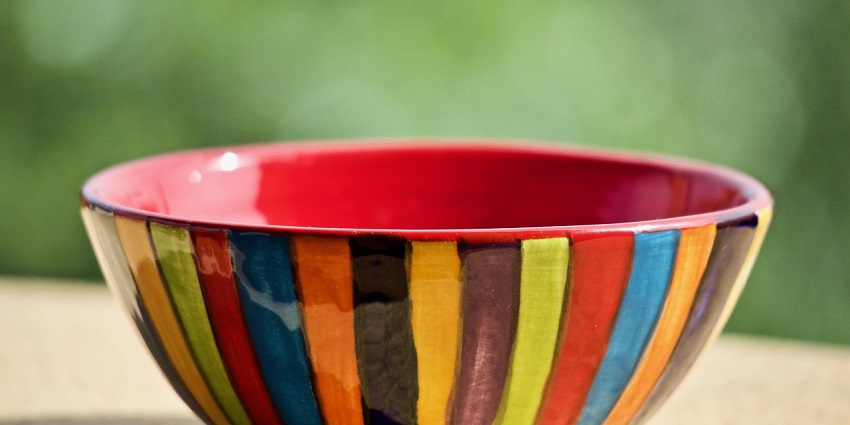 Delicately painted Thai ceramic bowls and dishes on display at a Phuket market.